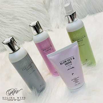 Regina Webb skincare products on a white, fluffy background.